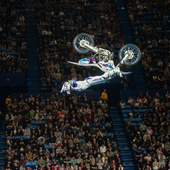 A photo of a motorcross rider as part of the Freestyle Kings performing doing a backflip whilst performing at RAC Arena in Perth