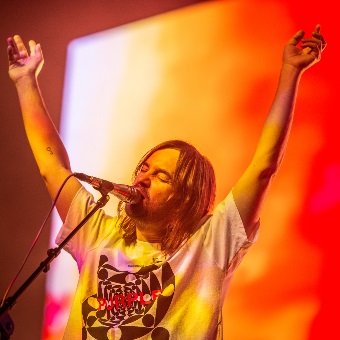 A photo of the singer of Tame Impala performing at RAC Arena in Perth