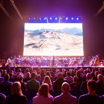 A photo of the crowd watching the orchestra play along with the Planet Earth Live performance at RAC Arena in Perth