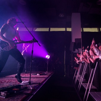 A photo of the artist Spacey Jane performing to a standing crowd at RAC Arena in Perth