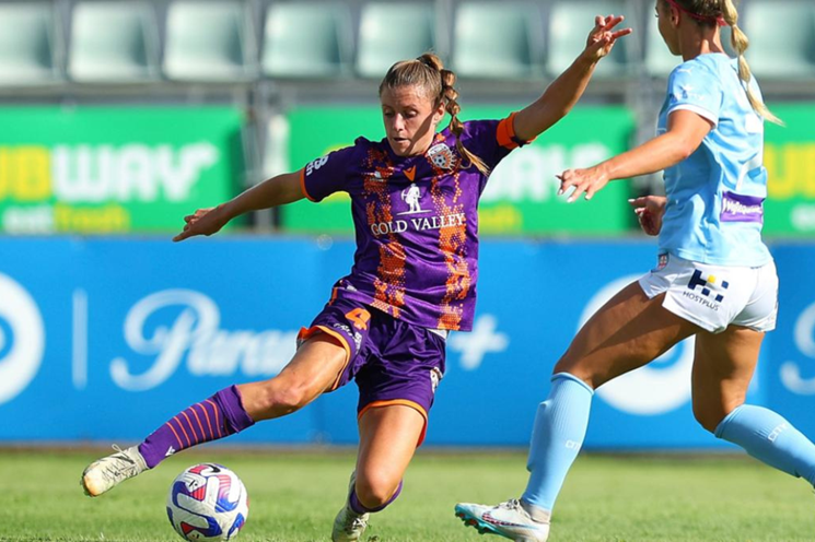 A photo of former Perth Glory soccer player Tash Rigby competing for the ball against another player